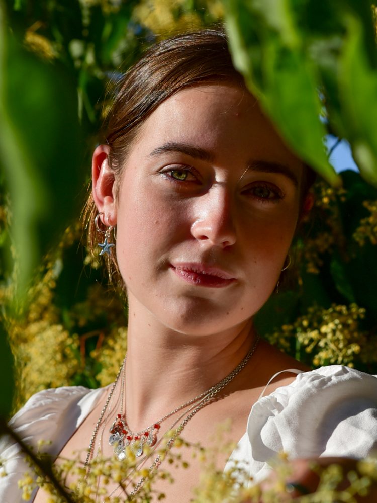 Photo of Zara, Circulus Jewellery owner at a summer day in Kew gardens featuring her jewellery products / photography by Bruna Balodis