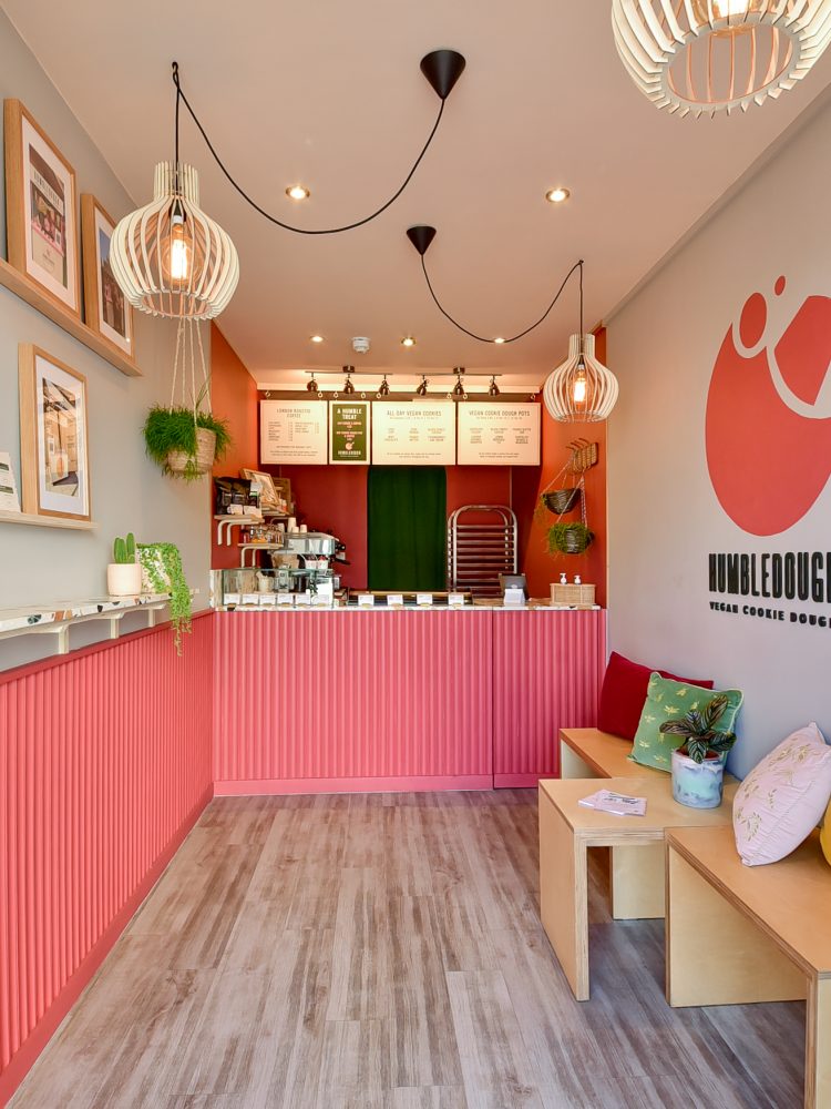 Photo of the interior design of a pink vegan cookie shop in box park containers in Shoreditch called the HumbleDough in London / Interior photo by Bruna Balodis photography
